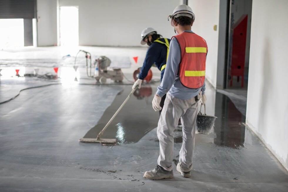 Construction,Worker,Painting,Epoxy,Flooring,Or,Floor,Hardener